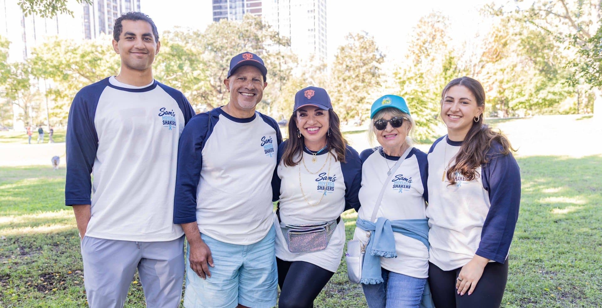 Five volunteers in Sam's Movers and Shakers raglan tees